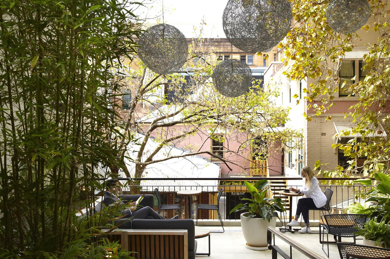 Leafy terrace seating at Eric's Bar overlooking The Rocks